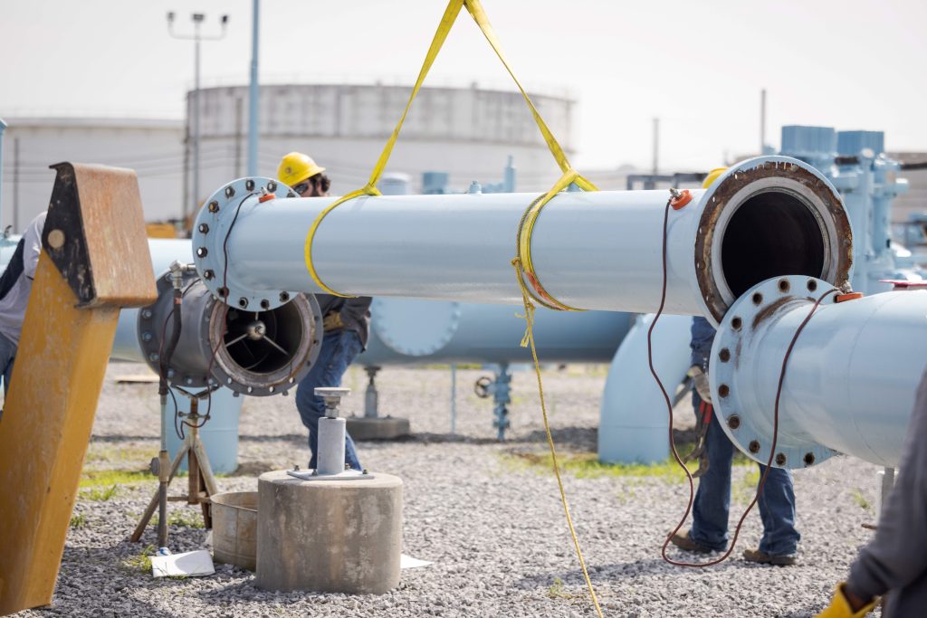 employees working on an oil and gas pipeline