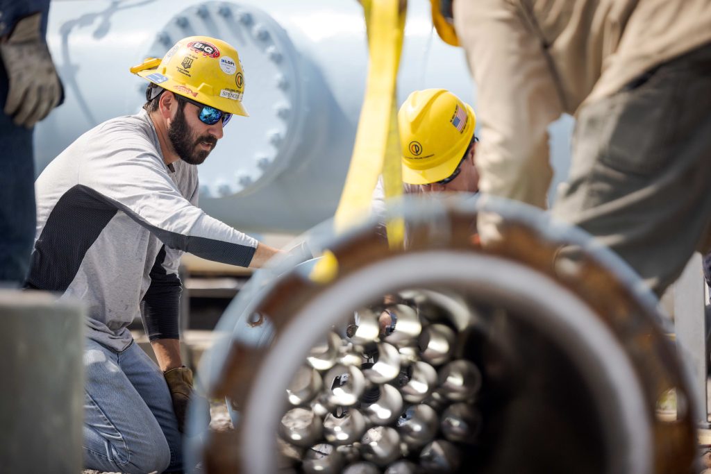 employees working on an oil and gas pipeline